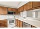 Functional kitchen with white countertops and stainless steel appliances at 3948 W Butler St, Chandler, AZ 85226