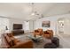 Comfortable living room featuring a stylish leather sofa and chairs at 3948 W Butler St, Chandler, AZ 85226