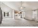 Large living room with big windows, carpet, and neutral walls at 3948 W Butler St, Chandler, AZ 85226