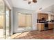 Kitchen featuring sliding glass door to patio, a window and wood cabinetry at 448 E Wescott Dr, Phoenix, AZ 85024