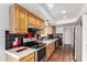 Bright kitchen with stainless steel appliances, tile flooring, and eye-catching black, white, and red tile backsplash at 448 E Wescott Dr, Phoenix, AZ 85024