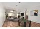 Inviting living room featuring terra cotta floors, vaulted ceiling, and cozy fireplace at 448 E Wescott Dr, Phoenix, AZ 85024