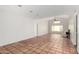 Open-concept living room with a large window, vaulted ceiling and tile floors at 448 E Wescott Dr, Phoenix, AZ 85024