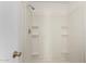 Clean and well-maintained shower stall featuring built-in shelving and bright lighting at 448 E Wescott Dr, Phoenix, AZ 85024