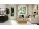 A bright living room with stylish furniture, decor, and a door leading to outdoor space providing a serene atmosphere at 4646 E French Rd, San Tan Valley, AZ 85143