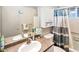 Bathroom featuring single sink vanity with granite countertop, and tub with shower at 4729 E Dolphin Ave, Mesa, AZ 85206