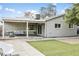 A spacious backyard with a covered patio and green grass at 4938 W Tuckey Ln, Glendale, AZ 85301