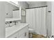 Bathroom featuring a modern vanity, framed mirror, shower and tub combination at 4938 W Tuckey Ln, Glendale, AZ 85301