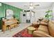 Spacious living area showcasing stylish furniture, a decorative wall, and an inviting atmosphere at 4938 W Tuckey Ln, Glendale, AZ 85301