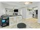 Open concept living space featuring a kitchen, living room with fireplace, and sliding glass door access at 4938 W Tuckey Ln, Glendale, AZ 85301