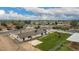 Aerial shot showcasing a spacious backyard, play structure, basketball hoop, and fencing, offering plenty of room to roam at 5038 W Acoma Dr, Glendale, AZ 85306