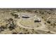 Overhead view of the property on desert land, with an outbuilding at 50525 W Whirly Bird Rd, Maricopa, AZ 85139
