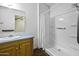 Bright bathroom showcasing a shower with curtain, vanity with mirror, and flooring at 50525 W Whirly Bird Rd, Maricopa, AZ 85139