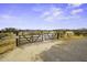 Entry gate leading to the property, enhancing privacy and security at 50525 W Whirly Bird Rd, Maricopa, AZ 85139