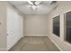 Simple bedroom features neutral carpet, double closet, and natural light from the windows at 5133 S Brice --, Mesa, AZ 85212