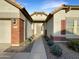 Inviting entry with a walkway lined with desert plants at 5133 S Brice --, Mesa, AZ 85212