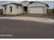 Charming single-story home featuring a two-car garage, neutral stucco, and a tile roof at 5147 N 177Th Ln, Litchfield Park, AZ 85340