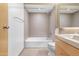 Bathroom featuring a bathtub, toilet, vanity with sink, and tile walls at 525 E Willetta St # 2, Phoenix, AZ 85004
