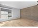 Modern bedroom offers hardwood floors, a minimalist design, and large windows, creating a serene and inviting space at 525 E Willetta St # 2, Phoenix, AZ 85004