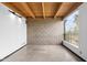 Bright bedroom featuring concrete floors, block walls and large window with outdoor view at 525 E Willetta St # 2, Phoenix, AZ 85004