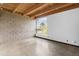 Spacious bedroom with concrete floors, block walls and large window with outdoor view at 525 E Willetta St # 2, Phoenix, AZ 85004