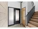 Modern entryway with stairs, a door, and exposed concrete block at 525 E Willetta St # 2, Phoenix, AZ 85004