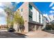 Modern apartment complex with a black car and a gated parking garage at 525 E Willetta St # 2, Phoenix, AZ 85004