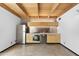 Modern kitchen with stainless steel appliances, wooden cabinets and unique wooden ceiling beams at 525 E Willetta St # 2, Phoenix, AZ 85004