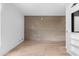 Open living room showcases hardwood floors and a concrete accent wall, creating a stylish and modern atmosphere at 525 E Willetta St # 2, Phoenix, AZ 85004