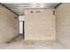 A neutral room with block walls, a metal ceiling, and industrial lighting at 525 E Willetta St # 2, Phoenix, AZ 85004
