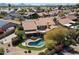 Home aerial view of the backyard, pool, and surrounding neighborhood at 5530 E Beck Ln, Scottsdale, AZ 85254
