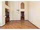 Bright and airy dining room area featuring wood floors and a stylish light fixture at 5530 E Beck Ln, Scottsdale, AZ 85254
