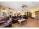 Expansive living room with wood floors, comfortable seating, and open access to other areas of the house at 5530 E Beck Ln, Scottsdale, AZ 85254