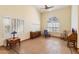 Spacious living room filled with natural light, tile flooring, and comfortable seating at 5530 E Beck Ln, Scottsdale, AZ 85254