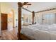The main bedroom has a beautiful four-poster bed and access to a large bathroom at 5530 E Beck Ln, Scottsdale, AZ 85254