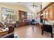 Office space with built in cabinets, ceiling fan and plenty of natural light at 5530 E Beck Ln, Scottsdale, AZ 85254