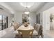 Bright dining room with stone-topped table under a skylight, complemented by modern decor and a view to patio at 5970 N Echo Canyon Dr, Phoenix, AZ 85018