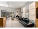 Spacious kitchen with a fireplace, backyard views, and a comfortable black leather daybed at 5970 N Echo Canyon Dr, Phoenix, AZ 85018
