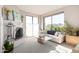 Bright living room with fireplace, neutral carpet, and ample natural light with mountain views at 5970 N Echo Canyon Dr, Phoenix, AZ 85018