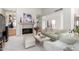 Comfortable living room featuring a stone fireplace, plush seating, and ample natural light for relaxing at 5970 N Echo Canyon Dr, Phoenix, AZ 85018