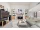 Inviting living room showcasing a fireplace, large TV, and comfortable seating, ideal for gatherings at 5970 N Echo Canyon Dr, Phoenix, AZ 85018
