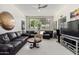 Living room features a large picture window with mountain views, furniture, and a ceiling fan at 5970 N Echo Canyon Dr, Phoenix, AZ 85018