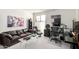 Bright home office featuring a sofa, workstation, natural light, and a well-organized bookshelf at 5970 N Echo Canyon Dr, Phoenix, AZ 85018