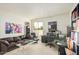 Inviting office space with a comfortable leather sofa, a large desk, and ample shelving at 5970 N Echo Canyon Dr, Phoenix, AZ 85018