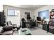 Stylish home office features a modern desk, ergonomic chair, and sleek black bookshelves, creating an ideal workspace at 5970 N Echo Canyon Dr, Phoenix, AZ 85018