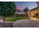 Beautiful backyard featuring lush green grass, a charming gazebo, and a covered patio, perfect for outdoor living at 6804 S 45Th Gln, Laveen, AZ 85339