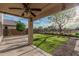 Spacious backyard with a well-manicured lawn and a covered patio, perfect for outdoor activities and relaxation at 6804 S 45Th Gln, Laveen, AZ 85339