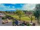 Landscaped backyard with patio and golf course view at 6804 S 45Th Gln, Laveen, AZ 85339