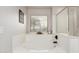 Bright bathroom featuring a soaking tub with tile accents, a glass shower, and neutral decor at 6804 S 45Th Gln, Laveen, AZ 85339