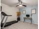 Bedroom featuring a ceiling fan, a desk and carpet flooring, creating a functional and inviting space at 6804 S 45Th Gln, Laveen, AZ 85339
